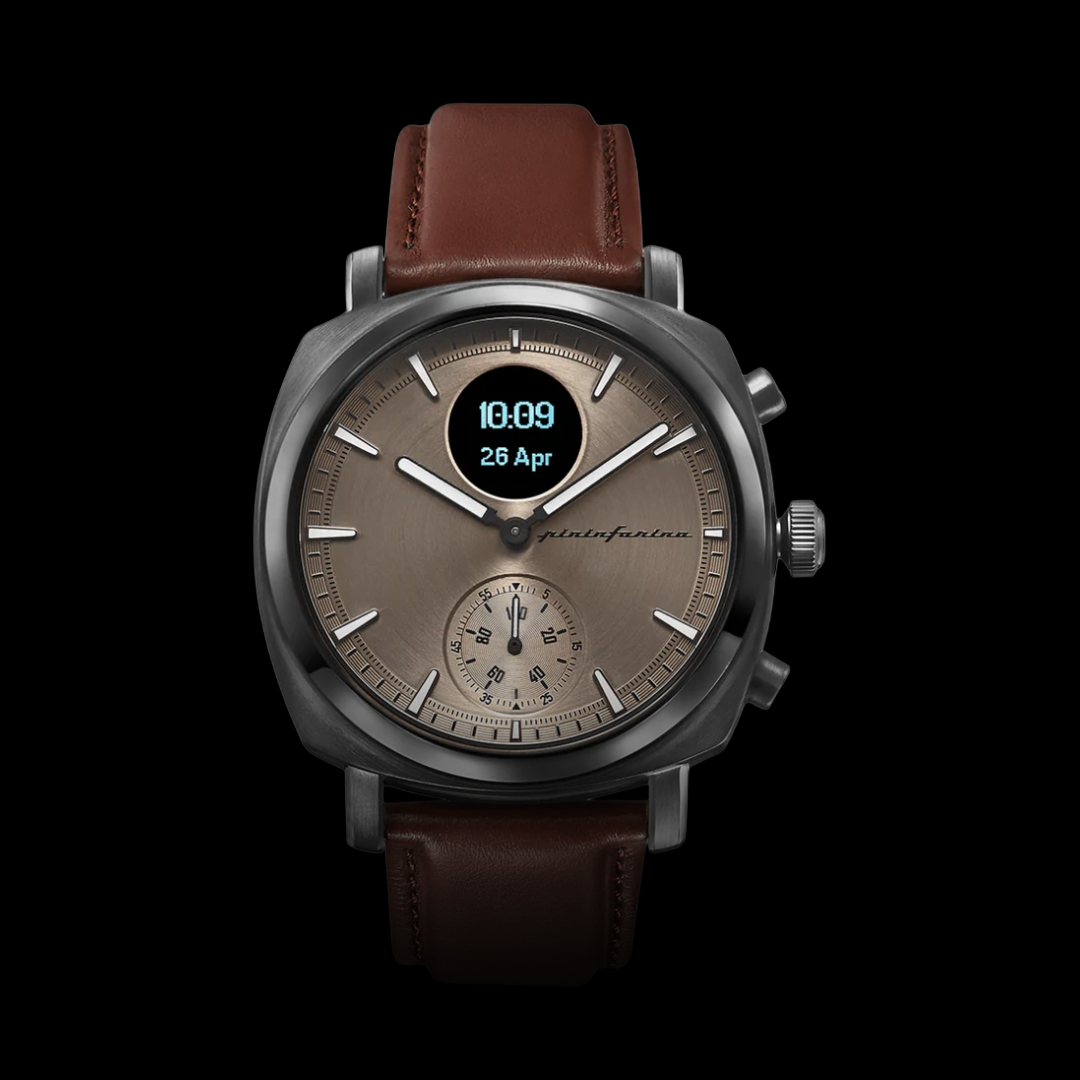 Watch with brown leather strap and brown dial on a black background
